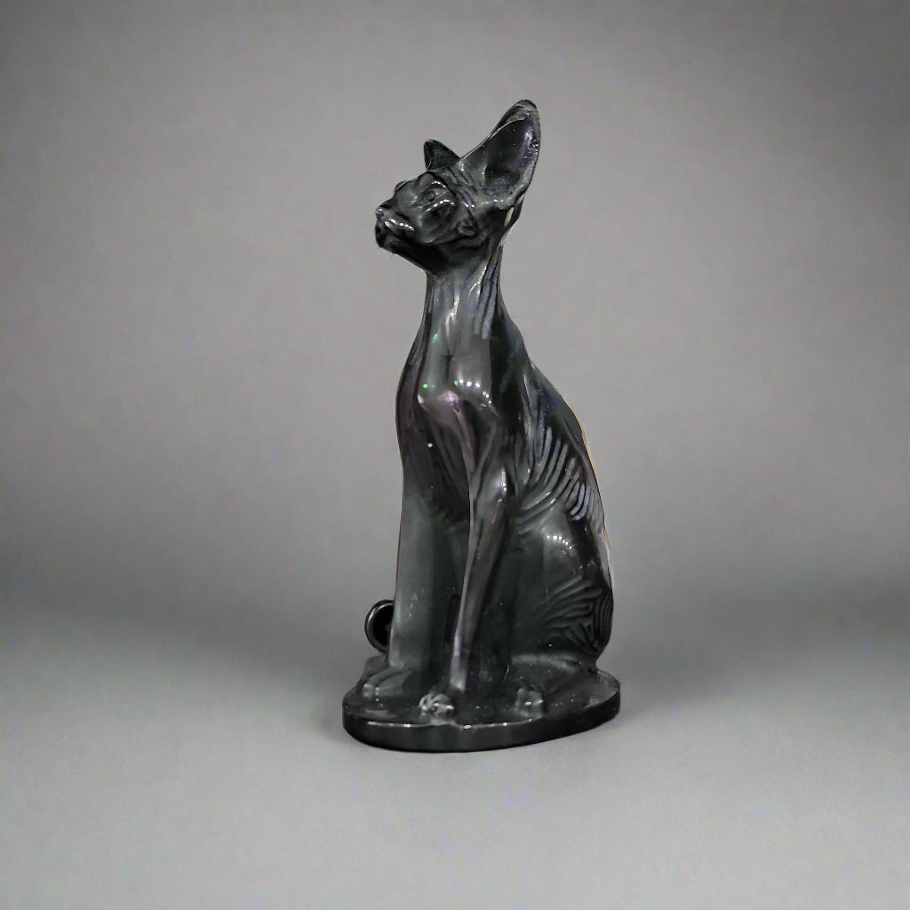 Hand-carved 6-inch Egyptian Hairless Cat Bast statue featuring sleek, hairless lines and expressive detail, inspired by the goddess Bastet, displayed on a white background.
