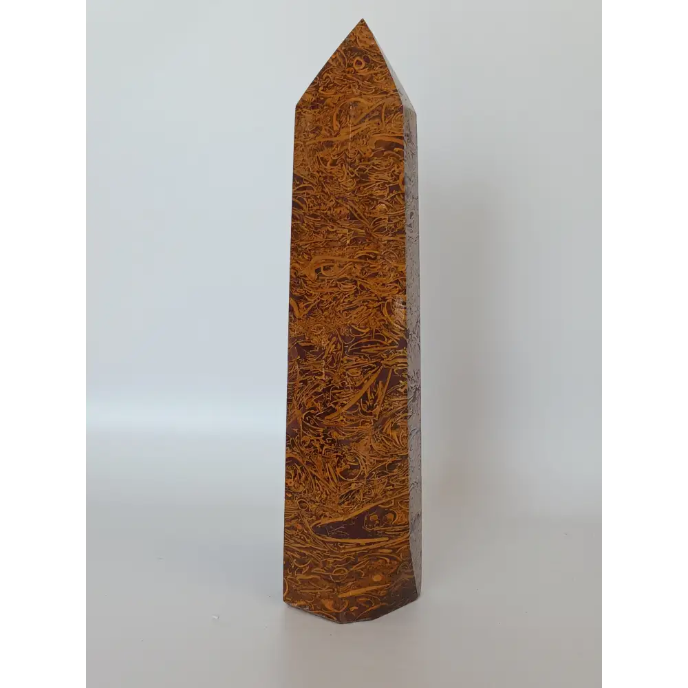 Hand-carved Golden Silk Jade tower featuring shimmering golden threads and a glossy finish, displayed on a white background.