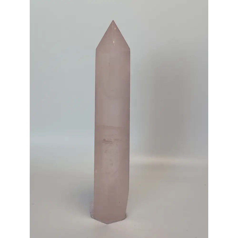 Hand-polished 5.5-inch Rose Quartz tower featuring vibrant, translucent pink hues, displayed on a white background.
