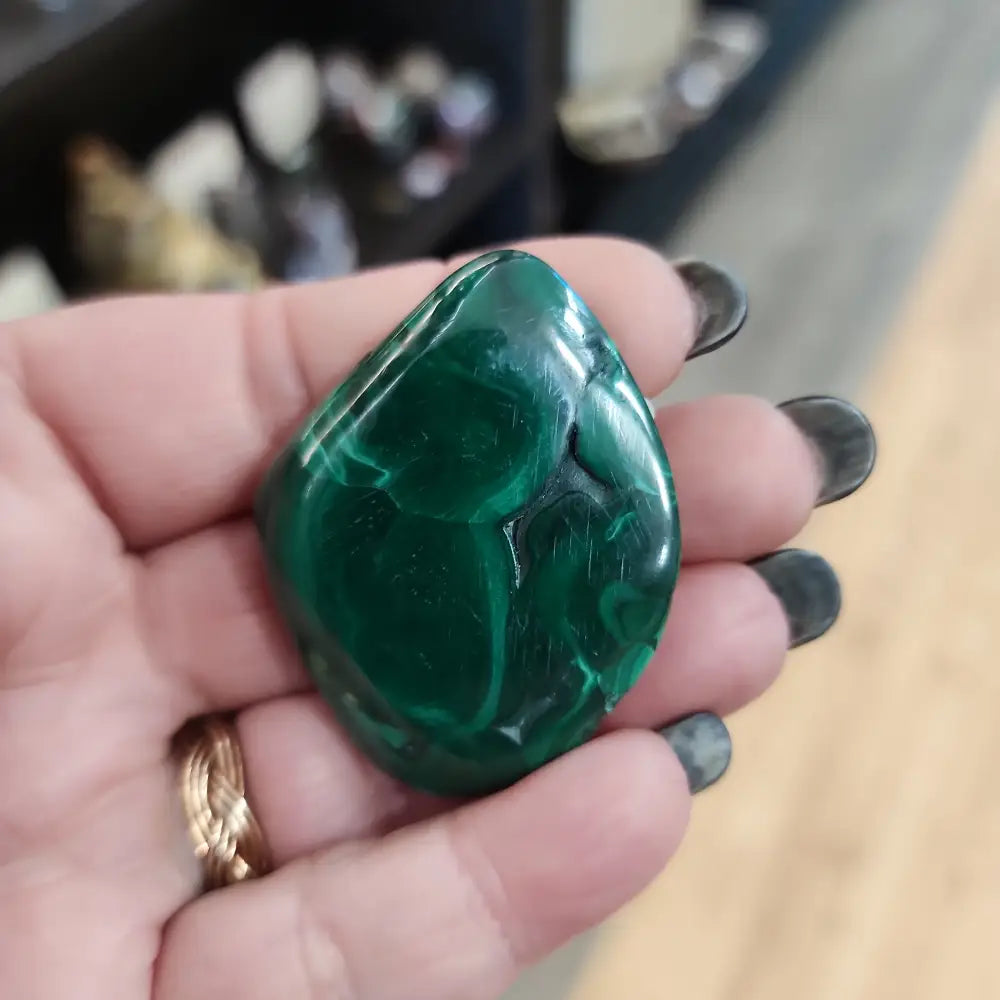 Hand-selected malachite specimen with vibrant green bands and natural patterns, displayed on a white background. Perfect for transformation, protection, and heart chakra healing.