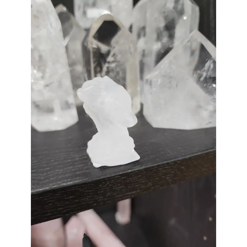 Hand-carved assorted crystal dragon heads, each 1 3/4 inches in size, featuring various colors and natural stone patterns, displayed on a white background. Perfect for power, wisdom, and magical protection.