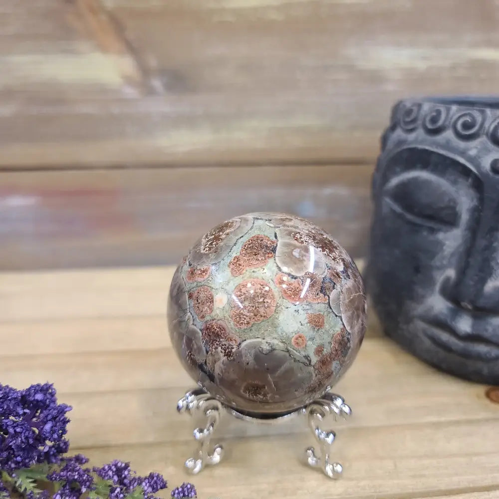 Hand-polished RARE Green Sakura Flower Agate featuring lush green tones and delicate, flower-like patterns reminiscent of cherry blossoms, displayed on a white background.