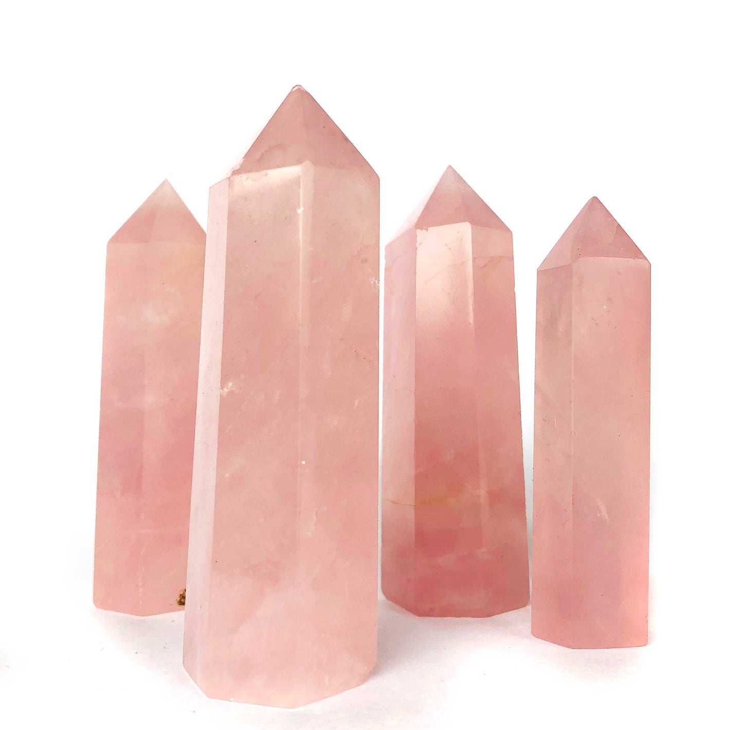 Hand-polished Rose Quartz tower featuring vibrant, translucent pink hues, displayed on a white background.