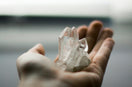 person holding crystal stones