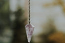 clear crystal hanging on chain