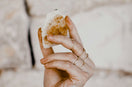 person holding bread with cheese