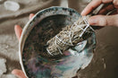 person holding blue and brown paint