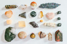 assorted color of stone on white table