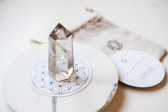 a diamond sitting on top of a white plate