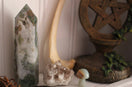 a couple of rocks sitting on top of a shelf
