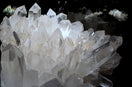 A cluster of crystals sitting on top of a table