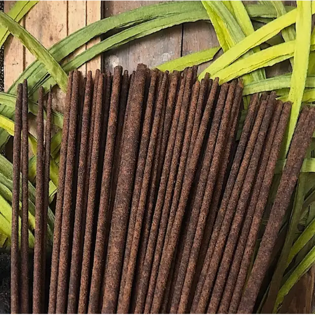 Bundle of 10 hand-dipped incense sticks with natural brown color, tied together and displayed on a white background. Perfect for meditation, ritual, and uplifting your space.
