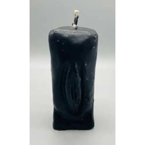 5 1/2" black candle shaped as a female figure, displayed on a white background. Perfect for protection, banishing, and empowered transformation.