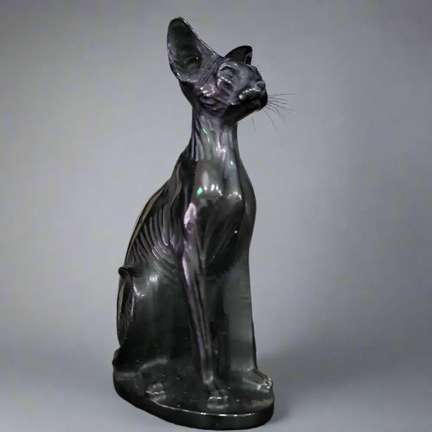 Hand-carved 6-inch Egyptian Hairless Cat Bast statue featuring sleek, hairless lines and expressive detail, inspired by the goddess Bastet, displayed on a white background.

