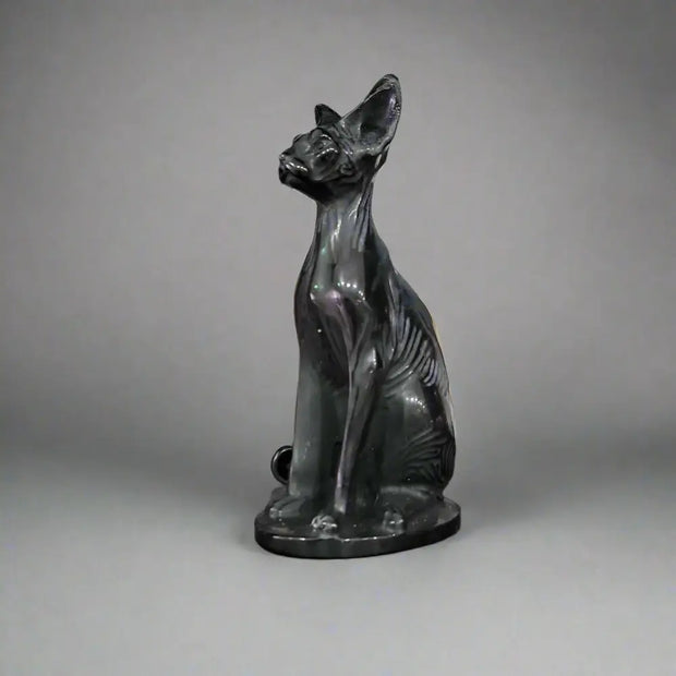 Hand-carved 6-inch Egyptian Hairless Cat Bast statue featuring sleek, hairless lines and expressive detail, inspired by the goddess Bastet, displayed on a white background.

