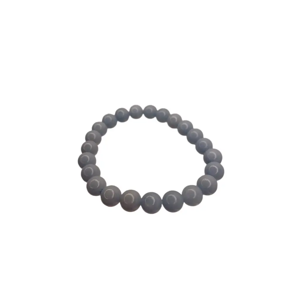 Blue beaded bracelet on a white surface