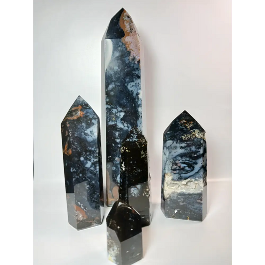 Hand-carved Blue Agate tower with soothing blue bands and natural patterns, displayed on a white background.