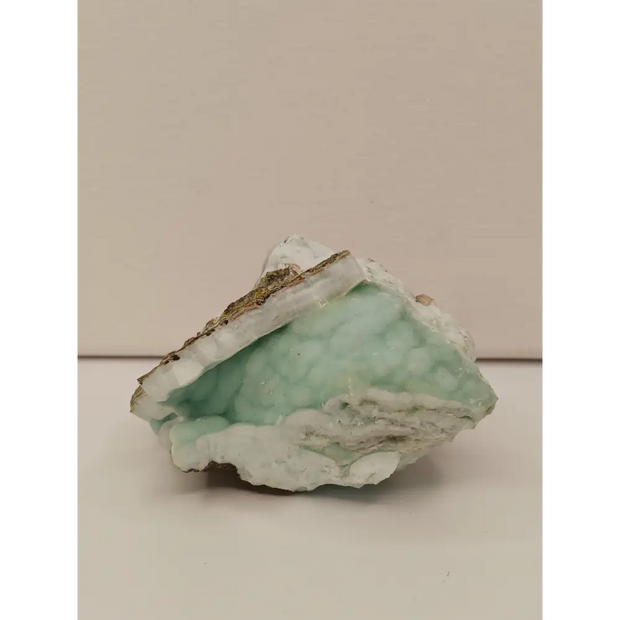 Natural Blue Aragonite specimen with tranquil blue hues and unique formations, displayed on a white background.