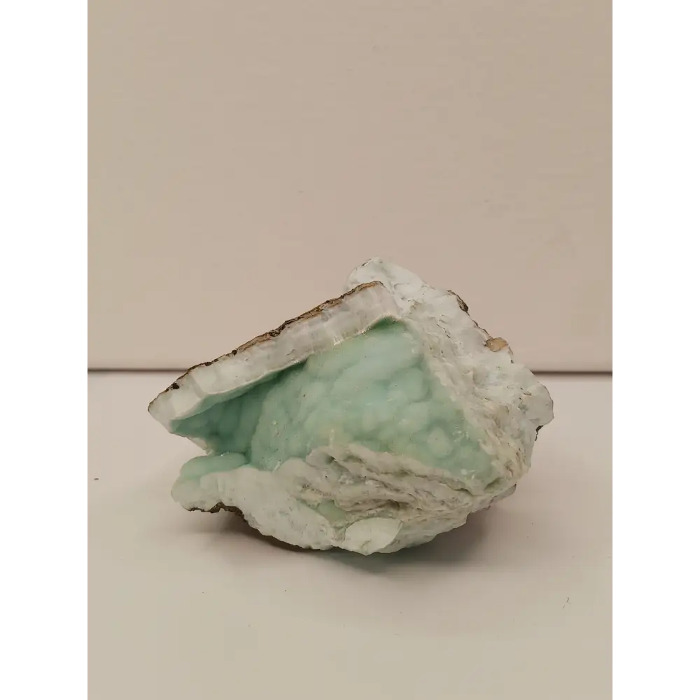 Natural Blue Aragonite specimen with tranquil blue hues and unique formations, displayed on a white background.