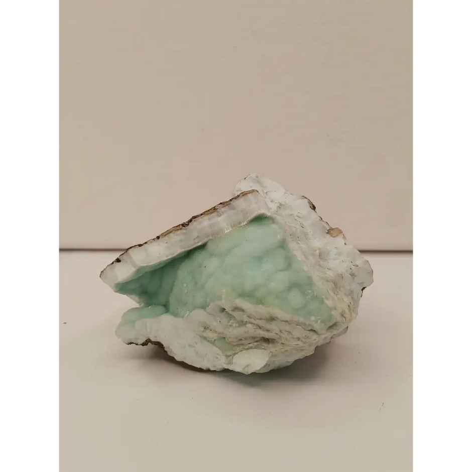 Natural Blue Aragonite specimen with tranquil blue hues and unique formations, displayed on a white background.