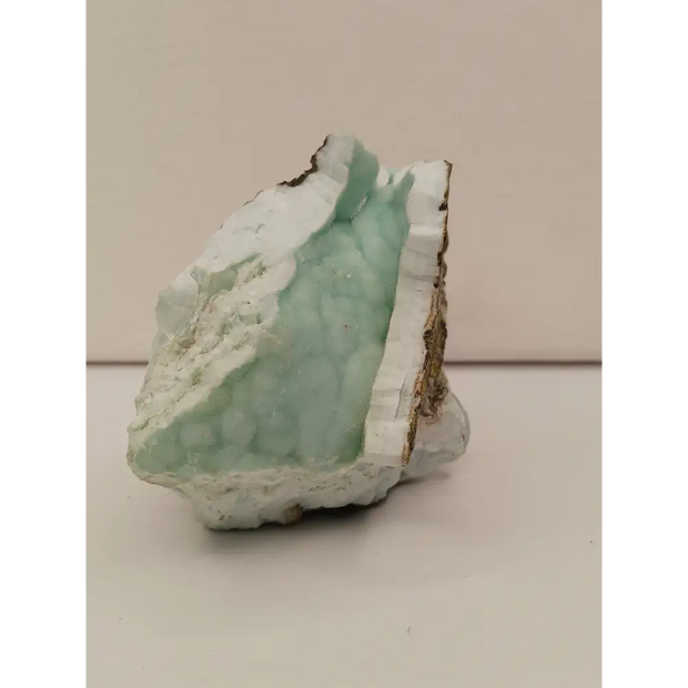 Natural Blue Aragonite specimen with tranquil blue hues and unique formations, displayed on a white background.