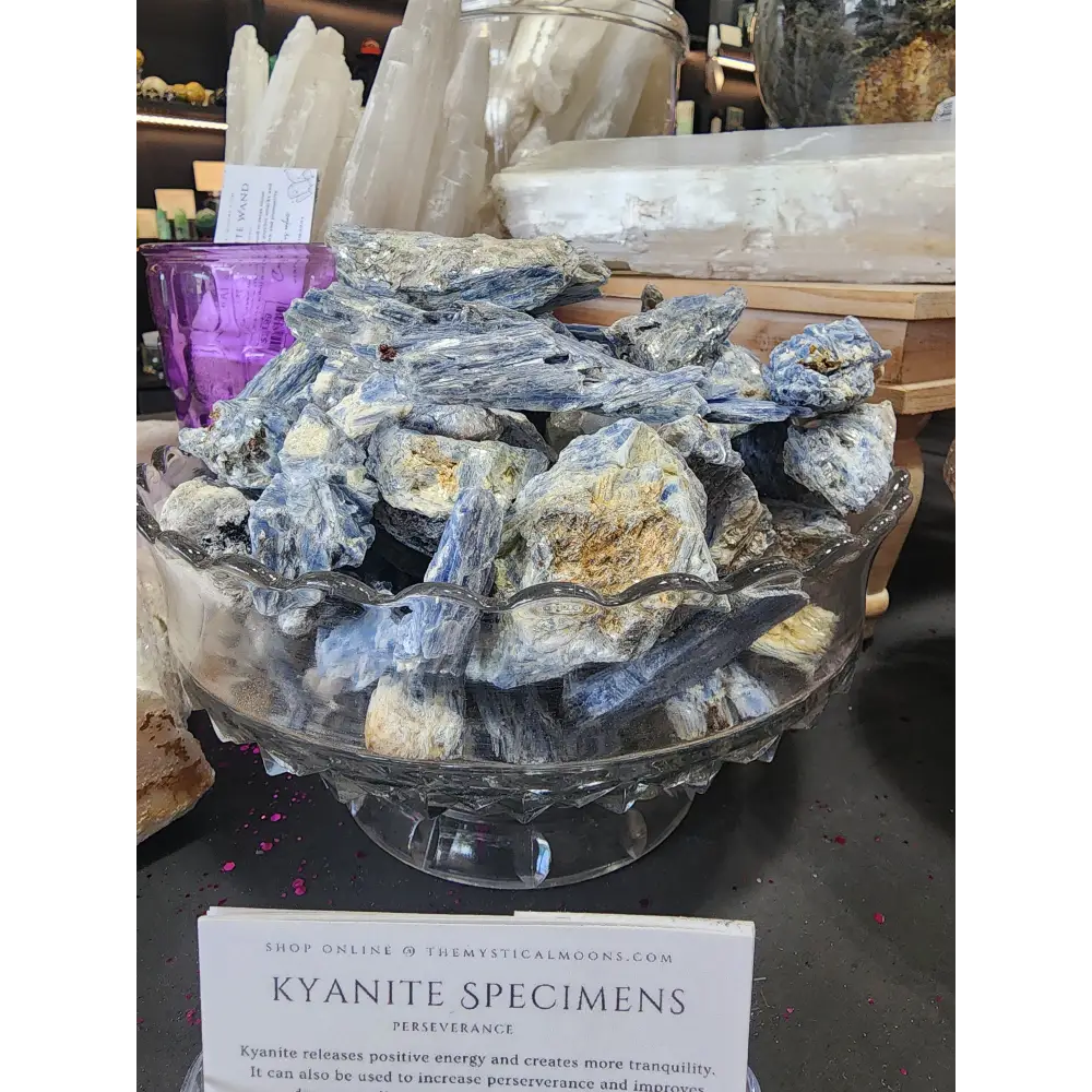 Raw blue kyanite specimen chunk with vibrant blue blades and natural texture, displayed on a white background. Perfect for chakra alignment, communication, and energetic balance.