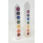 Hand-carved selenite obelisk with vibrant chakra stones arranged vertically, displayed on a white background. Perfect for cleansing, chakra alignment, and high-vibrational energy.