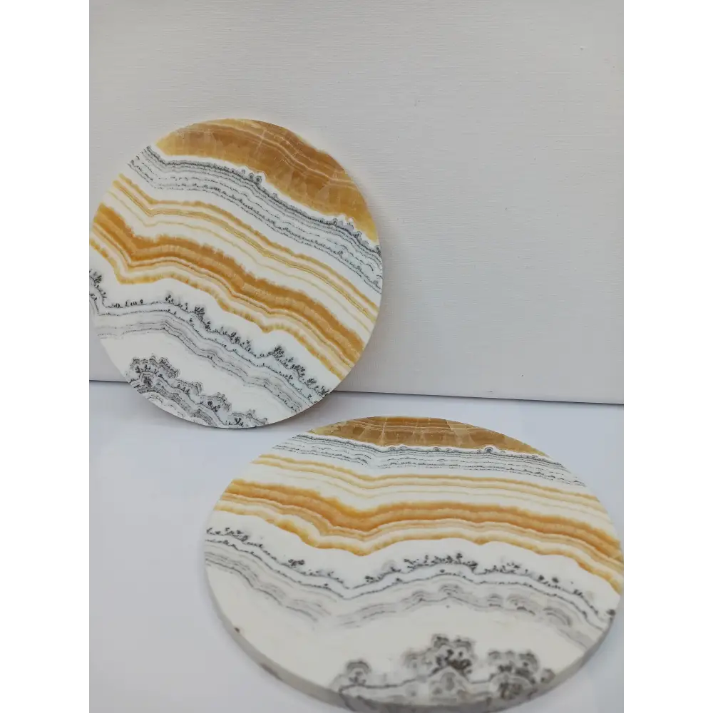 Dendritic Orange Calcite charging plate, 5.5 inches, with vibrant orange hues and natural dendritic patterns, displayed on a white background.