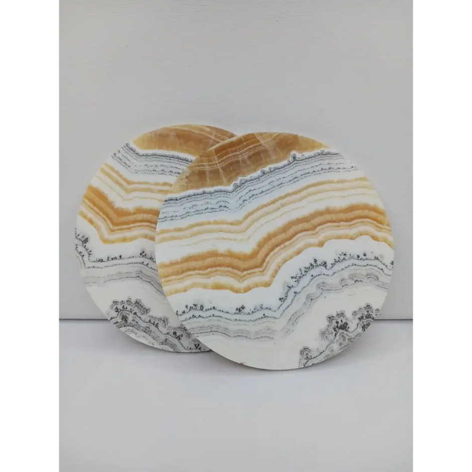 Dendritic Orange Calcite charging plate, 5.5 inches, with vibrant orange hues and natural dendritic patterns, displayed on a white background.