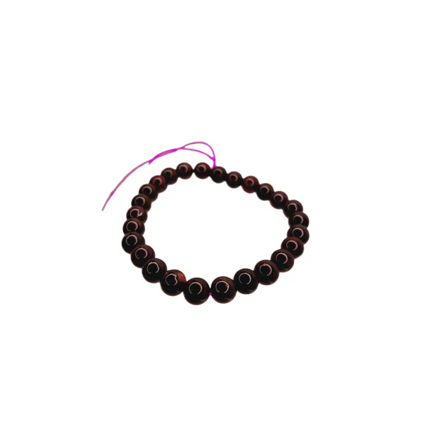 Black beaded bracelet on a white background