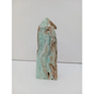 Hand-carved Gemy Hemimorphite tower with sparkling blue hues, displayed on a white background.
