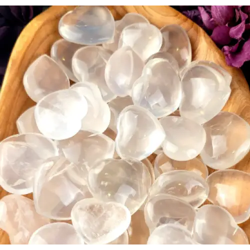 Hand-polished girasol quartz heart with a soft, milky translucence and gentle glow, displayed on a white background. Perfect for gentle clarity, emotional healing, and loving energy.
