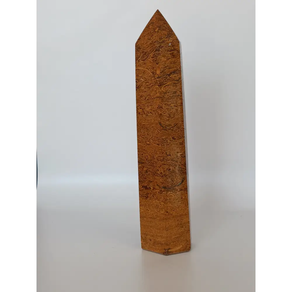 Hand-carved Golden Silk Jade tower featuring shimmering golden threads and a glossy finish, displayed on a white background.