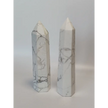 Hand-carved Howlite point featuring soft white coloring with graceful gray veining, displayed on a white background.