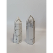 Hand-carved Howlite point featuring soft white coloring with graceful gray veining, displayed on a white background.