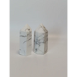 Hand-carved Howlite point featuring soft white coloring with graceful gray veining, displayed on a white background.