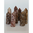 Hand-carved Leopard Jasper point featuring bold, earthy spotted patterns and a polished finish, displayed on a white background.