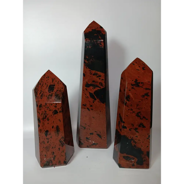 Hand-carved Mahogany Obsidian tower with rich brown and black swirls, displayed on a white background.