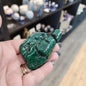 Hand-selected malachite specimen with vibrant green bands and natural patterns, displayed on a white background. Perfect for transformation, protection, and heart chakra healing.