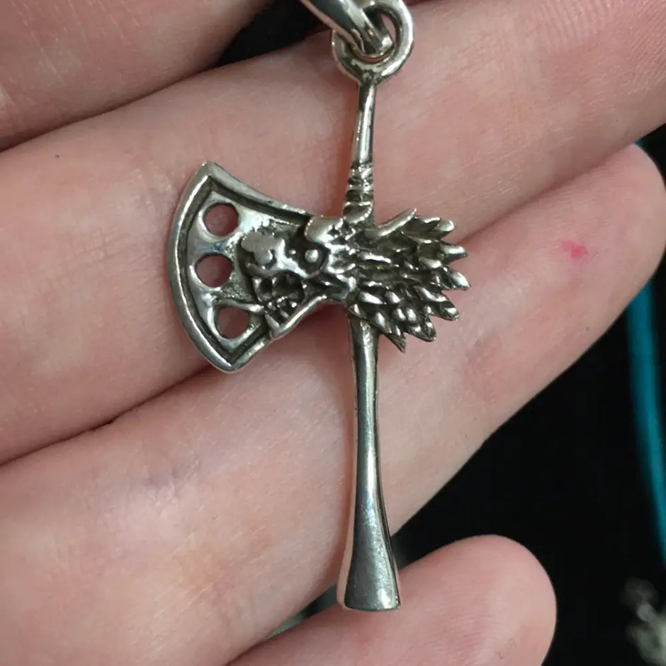 Pendant featuring a detailed Norse wolf and Viking axe, displayed on a white background. Perfect for strength, protection, and Viking spirit.