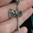 Pendant featuring a detailed Norse wolf and Viking axe, displayed on a white background. Perfect for strength, protection, and Viking spirit.