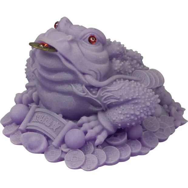 Frosted acrylic purple money toad Feng Shui figurine, three-legged and perched on coins, displayed on a white background.