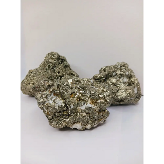 Gemmy Pyrite specimen with sparkling golden cubic crystals, displayed on a white background.