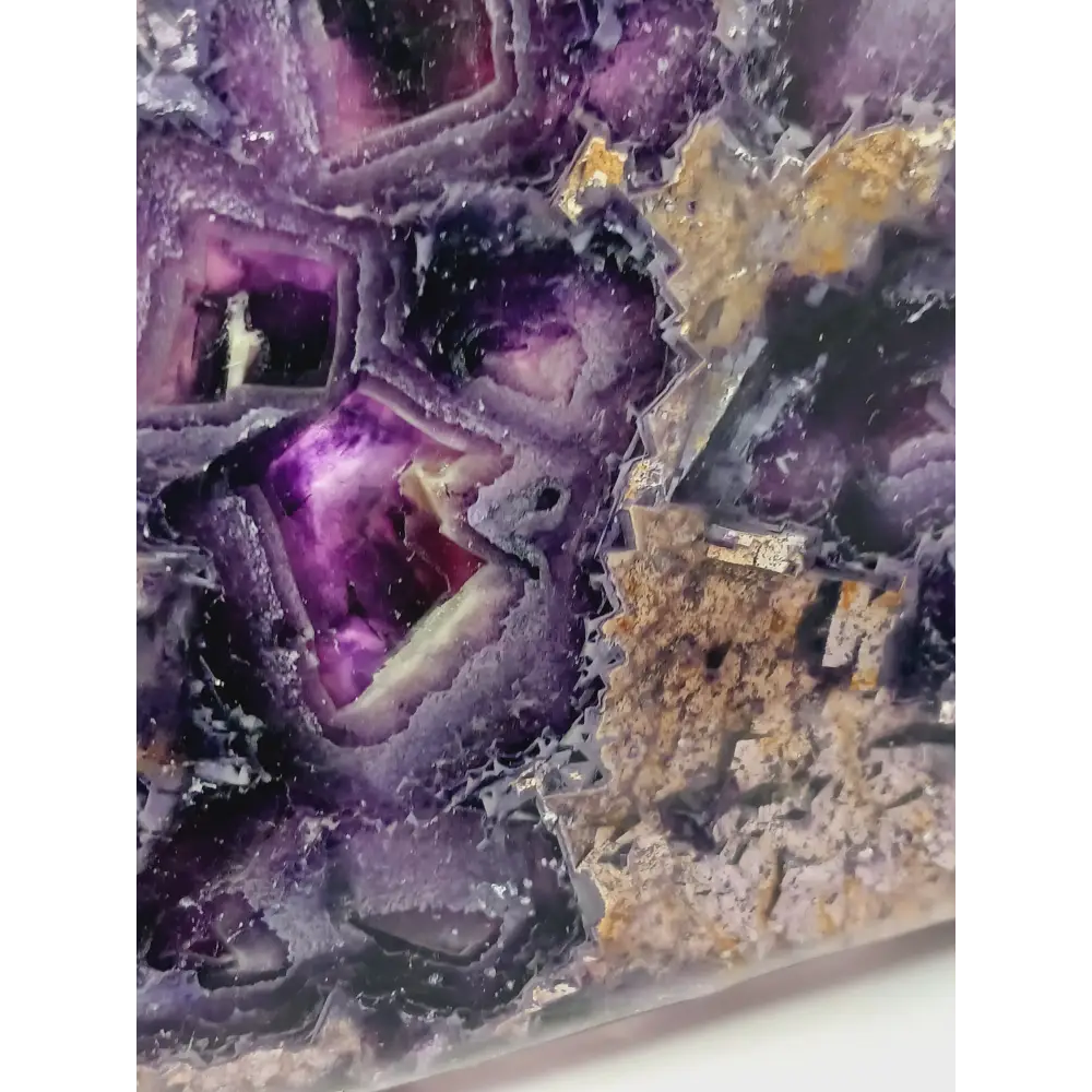 Rainbow fluorite bowl, 7.5 inches, with vibrant bands of color and a garden-like pattern on the back, displayed on a white background.