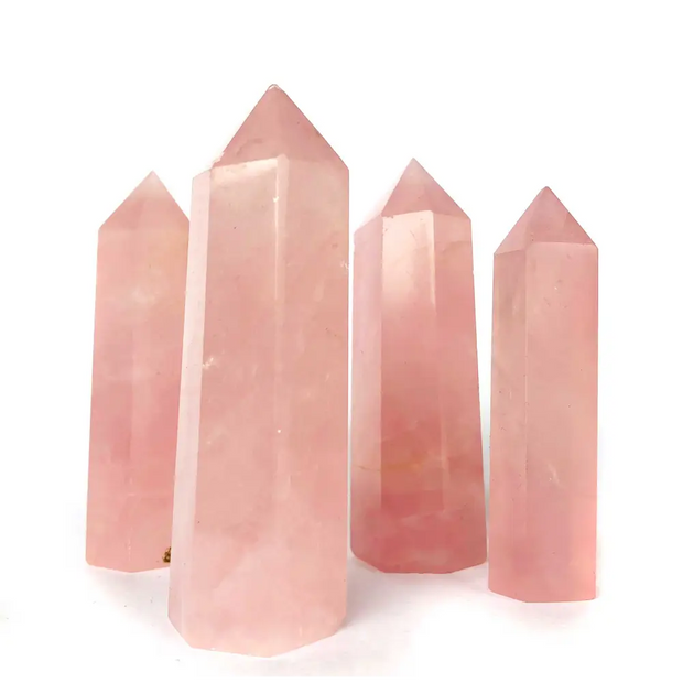Hand-polished Rose Quartz tower featuring vibrant, translucent pink hues, displayed on a white background.