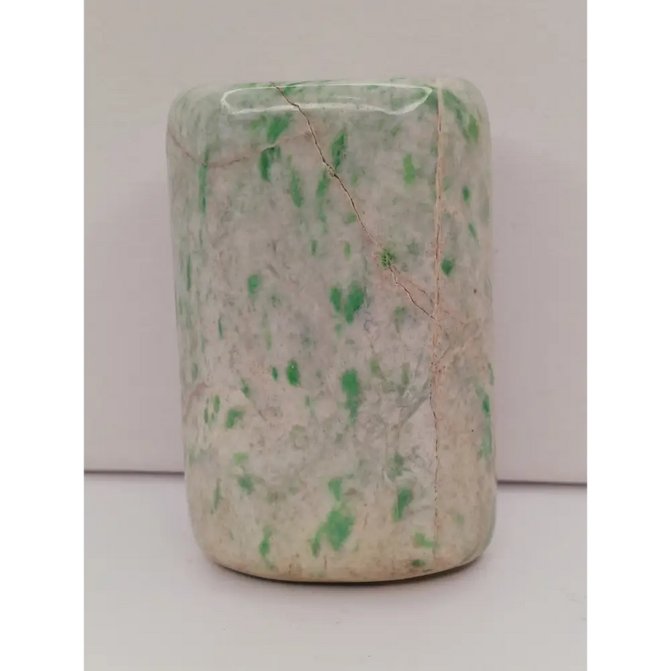 Sausserite freeform with soothing green hues and a unique, polished shape, displayed on a white background.