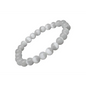 A white selenite bracelet with round beads laid out on a black surface.