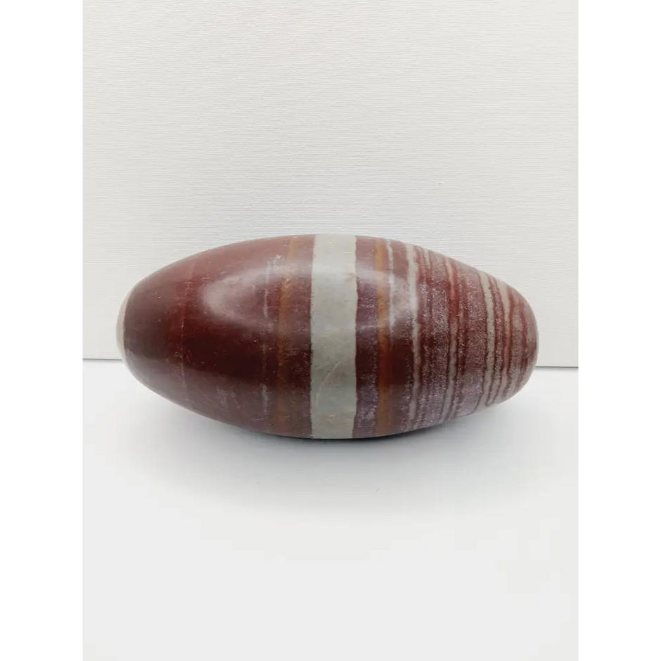 Shiva Lingam stones, polished with natural earthy patterns, available in sizes 1