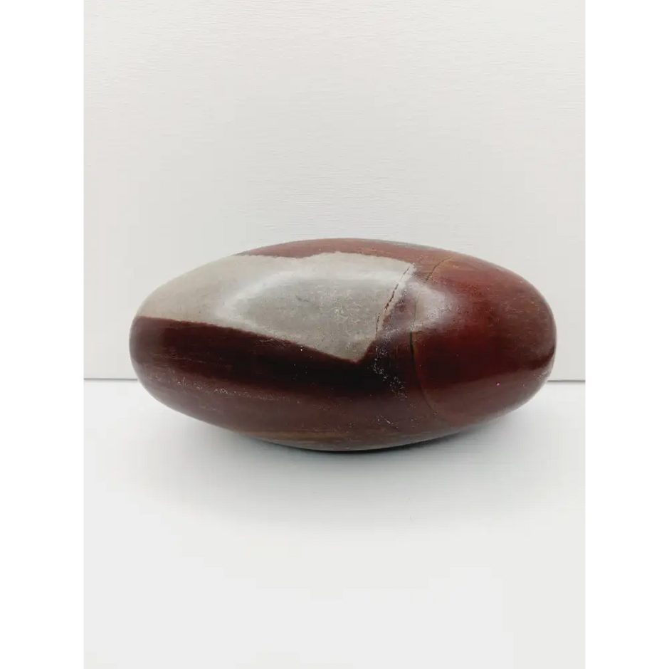 Shiva Lingam stones, polished with natural earthy patterns, available in sizes 1