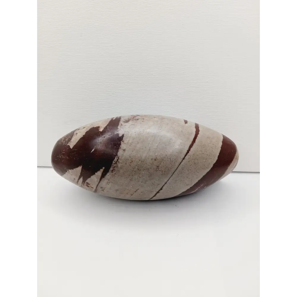 Shiva Lingam stones, polished with natural earthy patterns, available in sizes 1